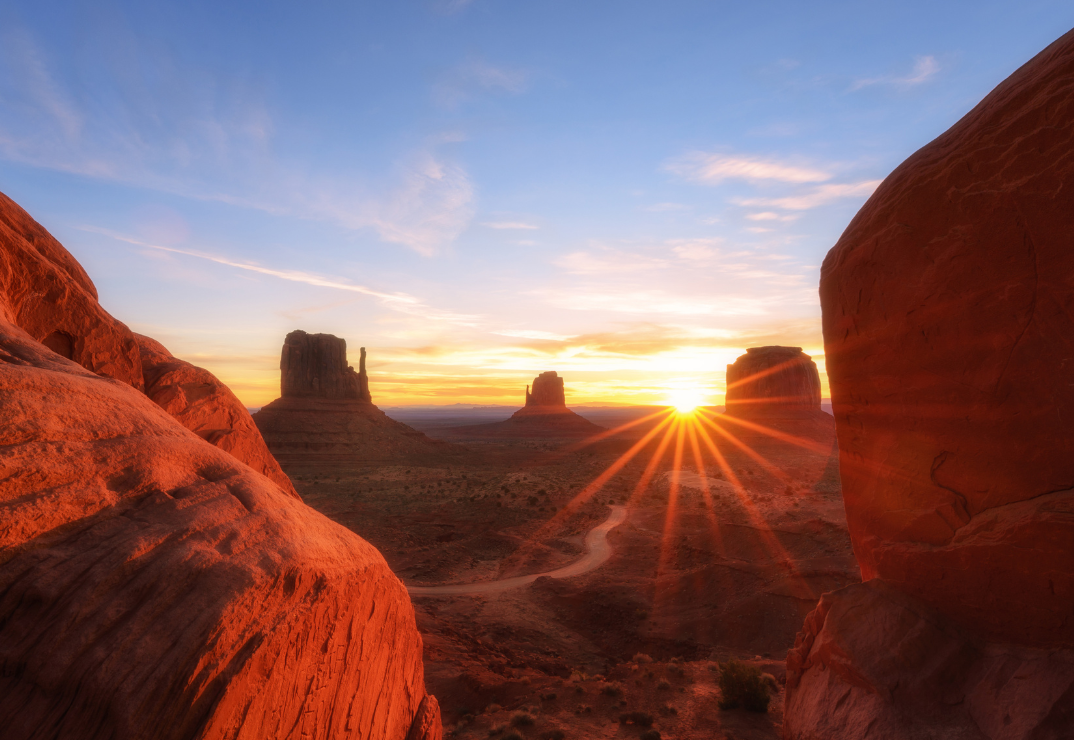 a canyon with a sunset in the background